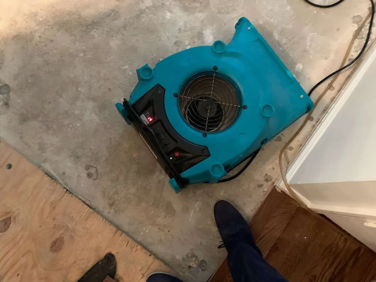 Air mover drying subfloor during Leak Detection & Repair in Northlake
